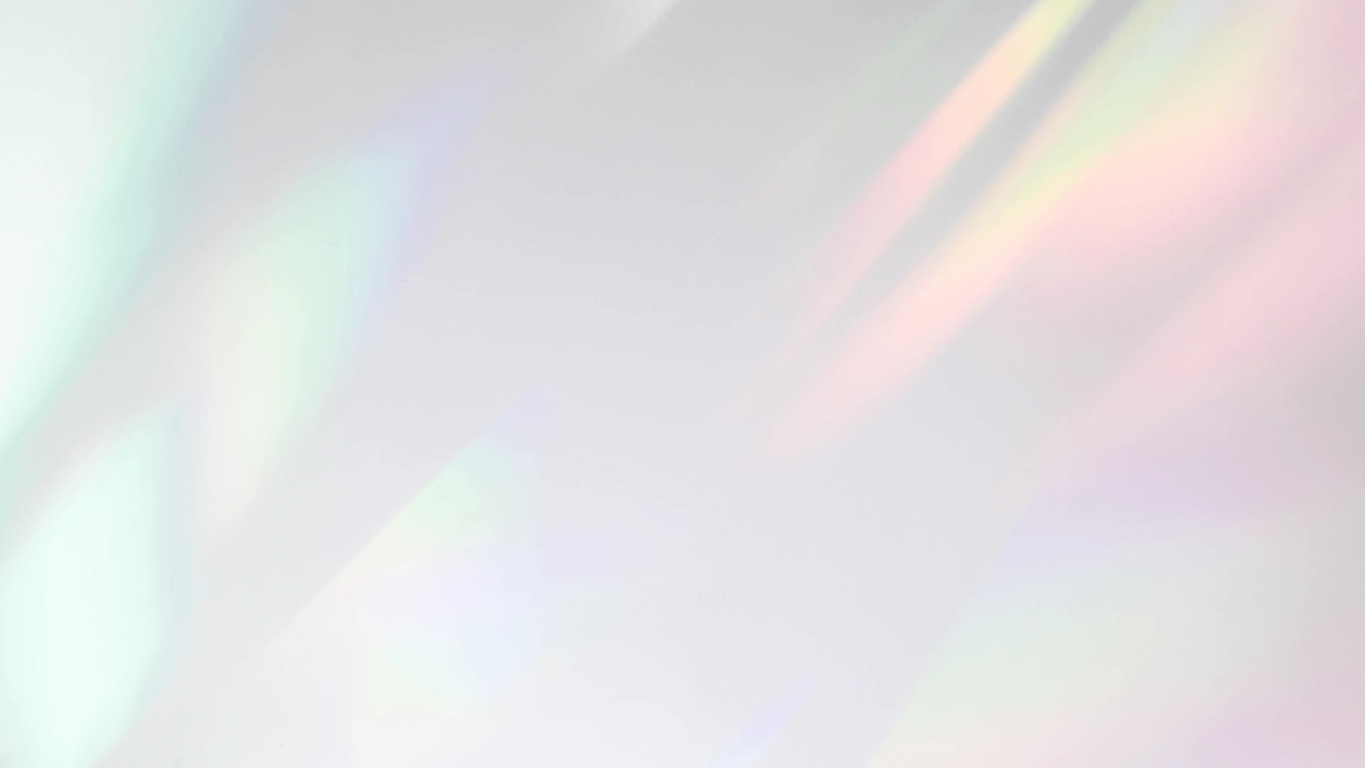 Background of vaguely pearlescent teal and pink blobs